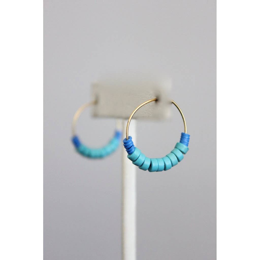 Gold hoop earrings with blue and green beaded accents 